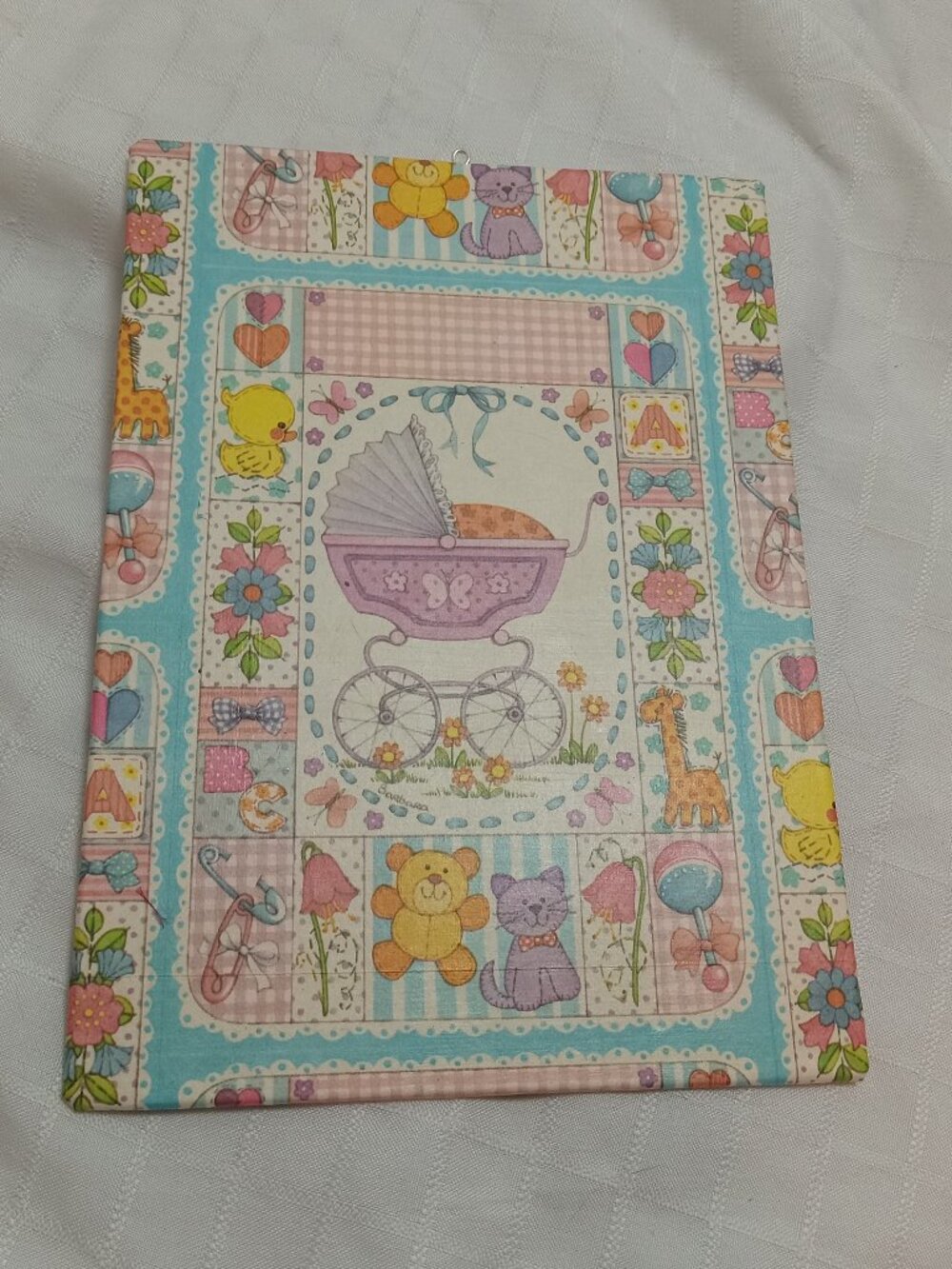 A delicate, handmade canvas made from thin vintage wrapping paper